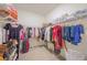 Walk-in closet with ample storage including shelves, clothing rods, and room for shoes and accessories at 5342 Maddie Dr, Haines City, FL 33844