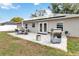 A patio and grill create an outdoor living space at 542 Bent Oak Loop, Davenport, FL 33837