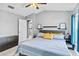 Comfortable main bedroom with ensuite and ceiling fan at 542 Bent Oak Loop, Davenport, FL 33837