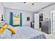 Bright main bedroom with large window and neutral decor at 542 Bent Oak Loop, Davenport, FL 33837