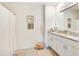 Bright bathroom with white cabinetry, granite countertops, and decorative accents at 574 Lady Grace Pl, Deland, FL 32724