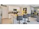Stylish kitchen featuring granite countertops, stainless steel appliances, and bar stool seating at 574 Lady Grace Pl, Deland, FL 32724