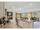 Spacious kitchen with granite countertops, stainless steel appliances, and open layout to living area at 574 Lady Grace Pl, Deland, FL 32724