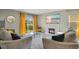 Comfortable living room with a fireplace, large TV, and sliding glass door at 574 Lady Grace Pl, Deland, FL 32724