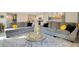 Open-concept living area with modern furniture and decor, adjacent to the kitchen at 574 Lady Grace Pl, Deland, FL 32724