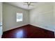 Bedroom featuring tile flooring, a ceiling fan and a window at 580 Ryan Ave, Apopka, FL 32712