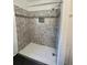 Shower featuring gray tile surround and a built in niche at 580 Ryan Ave, Apopka, FL 32712