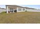 Expansive backyard with fencing, a covered patio, and plenty of green space at 5861 Bar Ranch Rd, St Cloud, FL 34771