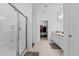 Bright bathroom featuring a walk-in shower with glass door and double sink vanity at 5861 Bar Ranch Rd, St Cloud, FL 34771