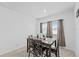 Cozy dining room setup with window views and neutral paint at 5861 Bar Ranch Rd, St Cloud, FL 34771