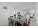 Open concept dining room with view to the living room and kitchen at 5861 Bar Ranch Rd, St Cloud, FL 34771