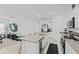 A bright, open-concept kitchen featuring granite countertops, stainless appliances and seamless flow into the living area at 5861 Bar Ranch Rd, St Cloud, FL 34771