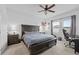 Spacious main bedroom features large windows for natural light and a ceiling fan at 5861 Bar Ranch Rd, St Cloud, FL 34771