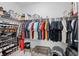 Walk-in closet featuring shelving for shoes and hanging rods for clothes at 5861 Bar Ranch Rd, St Cloud, FL 34771