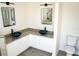 Modern bathroom with dual sinks, granite counters, and framed mirrors at 608 Bluebill Ct, Kissimmee, FL 34759