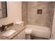 Bathroom features a tub-shower combo and a granite vanity at 608 Bluebill Ct, Kissimmee, FL 34759