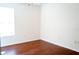 Bright bedroom with a window and hardwood floors provides a cozy space at 608 Bluebill Ct, Kissimmee, FL 34759