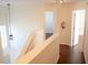 Upstairs hallway leading to multiple rooms in the home at 608 Bluebill Ct, Kissimmee, FL 34759