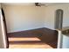 Living room featuring dark floors, neutral paint and access to the kitchen at 608 Bluebill Ct, Kissimmee, FL 34759