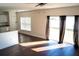 Living room featuring a sliding glass door, view of the backyard and access to the kitchen at 608 Bluebill Ct, Kissimmee, FL 34759
