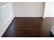 Upstairs living room with dark wood-look floors, white walls and trim, plus a large window at 608 Bluebill Ct, Kissimmee, FL 34759