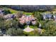 Private lakefront estate with lush landscaping and a luxurious pool at 6126 Kirkstone Ln, Windermere, FL 34786