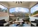 Relaxing balcony with comfortable seating and a beautiful view of the surrounding landscape at 6126 Kirkstone Ln, Windermere, FL 34786