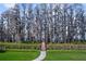 Picturesque walking path leading to the private dock and water at 6126 Kirkstone Ln, Windermere, FL 34786