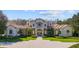 Beautiful home featuring lush landscaping, paver drive, and a meticulously maintained yard at 6126 Kirkstone Ln, Windermere, FL 34786