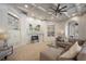 Spacious living room featuring custom built-ins, fireplace, and coffered ceilings at 6126 Kirkstone Ln, Windermere, FL 34786