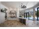 Outdoor kitchen features stainless steel appliances, bar seating, and access to the pool area at 6126 Kirkstone Ln, Windermere, FL 34786