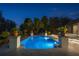 Inviting pool area at night, featuring elegant landscaping and a relaxing ambiance at 6126 Kirkstone Ln, Windermere, FL 34786