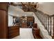 Spacious walk-in closet featuring custom wood shelving, staircase, and a decorative chandelier at 6126 Kirkstone Ln, Windermere, FL 34786