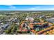 Overhead shot showcasing the property within a community, with water views, landscaping, and parking at 6157 Metrowest Blvd # 106, Orlando, FL 32835