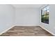 Bright bedroom featuring hardwood floors, a window and neutral wall color at 6157 Metrowest Blvd # 106, Orlando, FL 32835