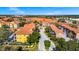 Exterior shot highlighting the condo's architecture and proximity to tree-lined streets within a vibrant neighborhood at 6157 Metrowest Blvd # 106, Orlando, FL 32835