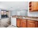Spacious kitchen area with stainless steel sink, dishwasher, and a view of the outside at 6157 Metrowest Blvd # 106, Orlando, FL 32835