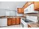 Bright kitchen featuring a stainless steel sink, and plenty of cabinet space at 6157 Metrowest Blvd # 106, Orlando, FL 32835