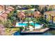 Aerial image showcasing a spacious pool area with mature trees and palm trees in a beautiful residential community at 6157 Metrowest Blvd # 106, Orlando, FL 32835
