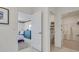 Inviting hallway showcasing open doorways to a bedroom and a walk-in closet at 7083 Painted Bunting Way, St Cloud, FL 34773