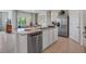 Open kitchen featuring granite countertops, stainless steel appliances, and a breakfast bar for casual dining at 7083 Painted Bunting Way, St Cloud, FL 34773