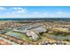 A scenic aerial view of a residential community, showing a mix of housing options and stunning lakeside views at 7509 Oak Spring Ln, Davenport, FL 33837