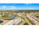 Community aerial view of the neighborhood featuring homes nestled around lakes, offering a peaceful and scenic living environment at 7509 Oak Spring Ln, Davenport, FL 33837