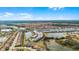 An aerial view of a well-planned residential community, highlighting the variety of home styles and picturesque water features at 7509 Oak Spring Ln, Davenport, FL 33837