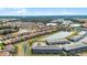 Expansive aerial view showcasing the community's layout including waterways, and neighborhood landscape at 7509 Oak Spring Ln, Davenport, FL 33837