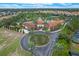 Community aerial view with landscaping, and tile-roofed community center, pool, and other amenities at 7509 Oak Spring Ln, Davenport, FL 33837