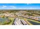 Aerial view of the community showcasing a serene environment with waterways and neighborhood landscape at 7509 Oak Spring Ln, Davenport, FL 33837