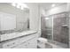 Clean bathroom featuring a shower, granite countertops, and modern fixtures at 7509 Oak Spring Ln, Davenport, FL 33837