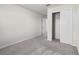 Carpeted bedroom with closet and ensuite access at 7509 Oak Spring Ln, Davenport, FL 33837