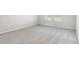 Inviting bedroom with neutral carpet and a window with outdoor views at 7509 Oak Spring Ln, Davenport, FL 33837